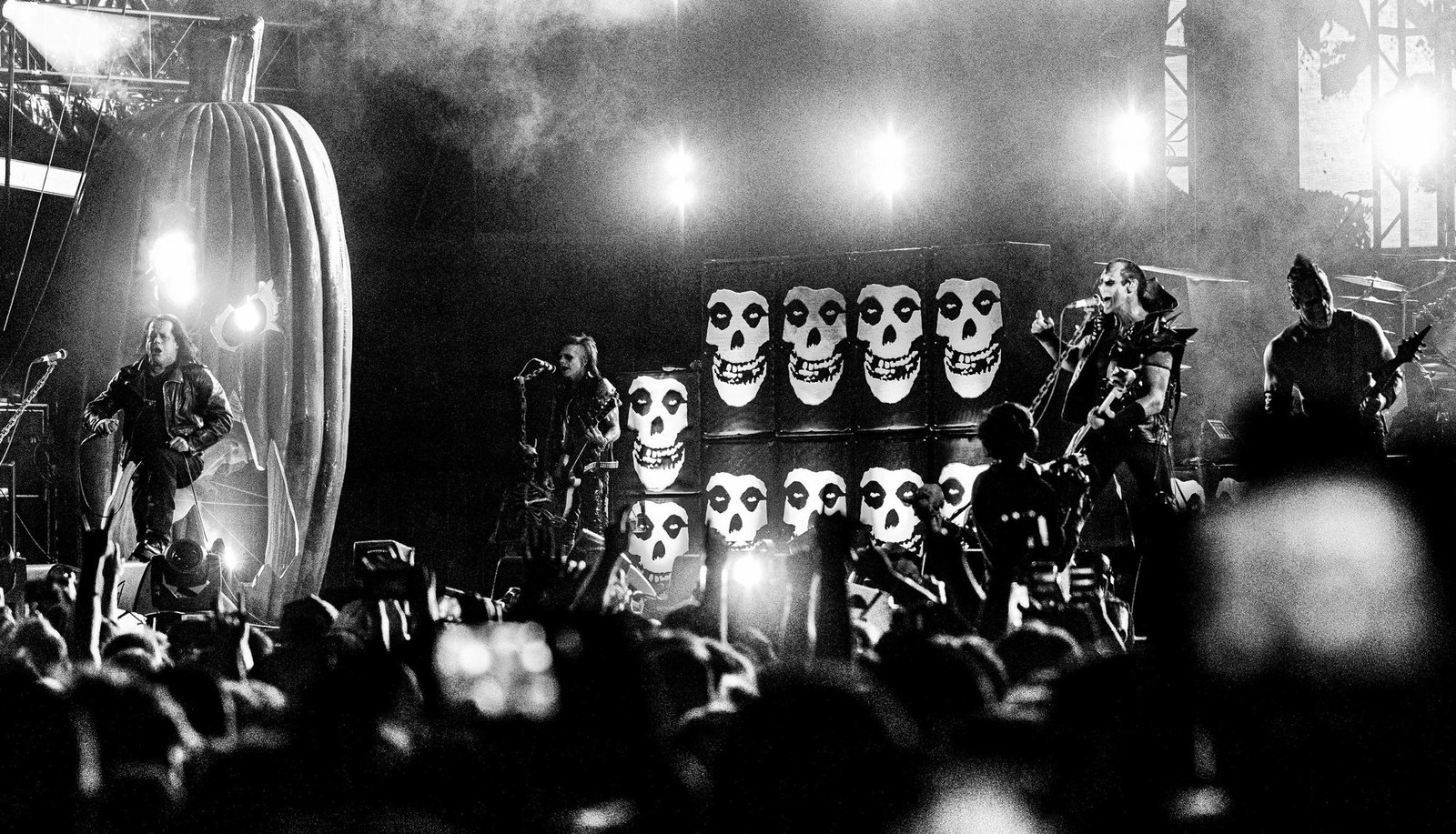 The Original Misfits on stage at Riot Fest Denver, 2016, giant Crimson Ghost skulls behind the drum riser