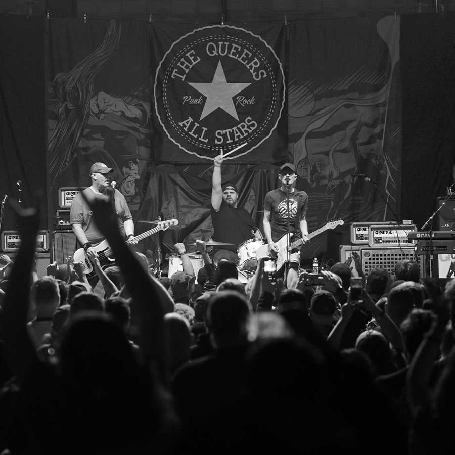 The Queers live at the Hobart Art Theater, crowd with hands up, black and white